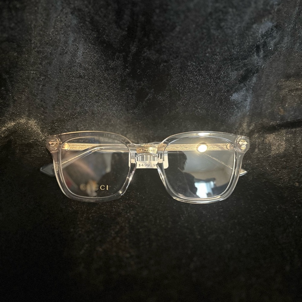 Clear Gucci Glass with a gold trim.